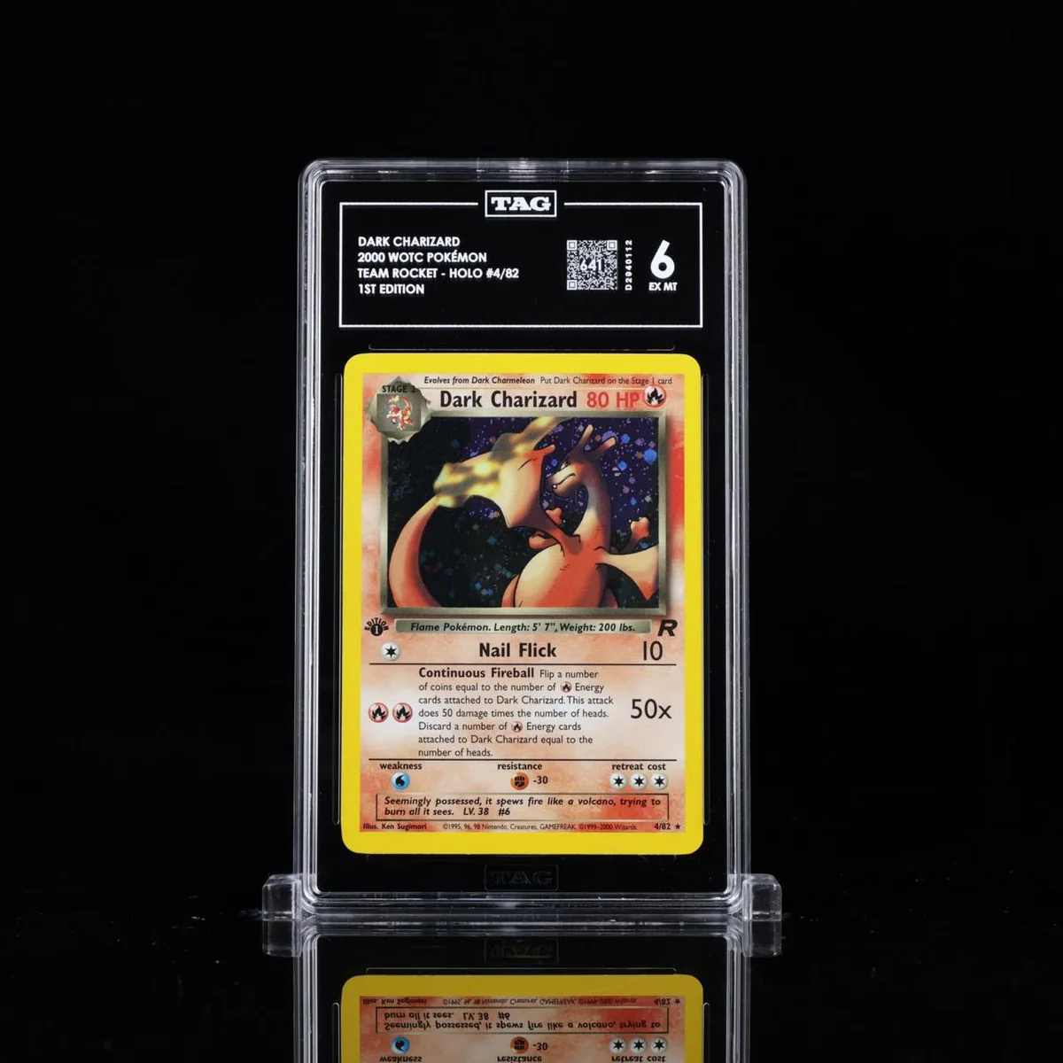 TAG graded Dark Charizard slab displayed on a black reflective surface