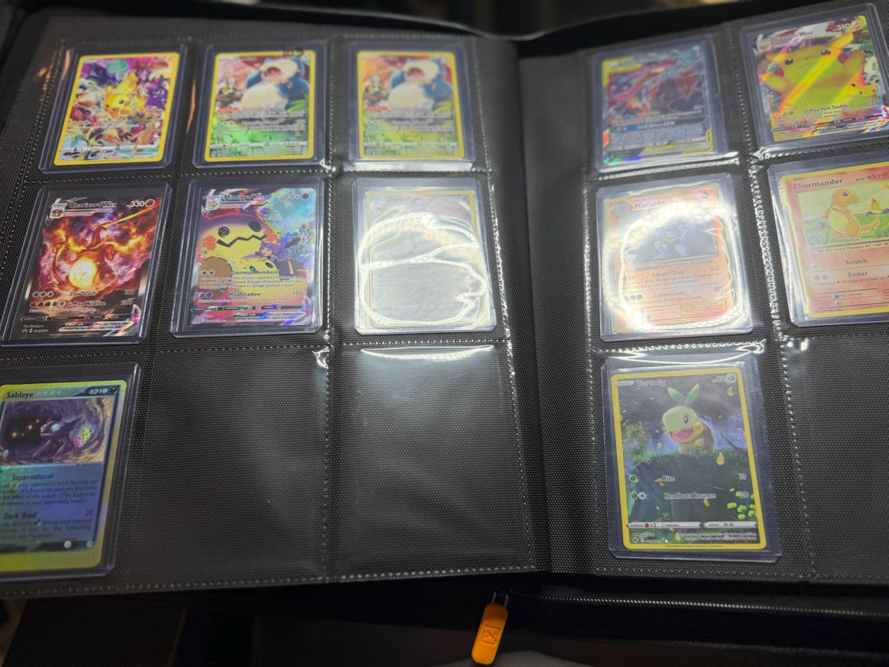 Pokemon cards organized in a binder for Card Consignor consignment review