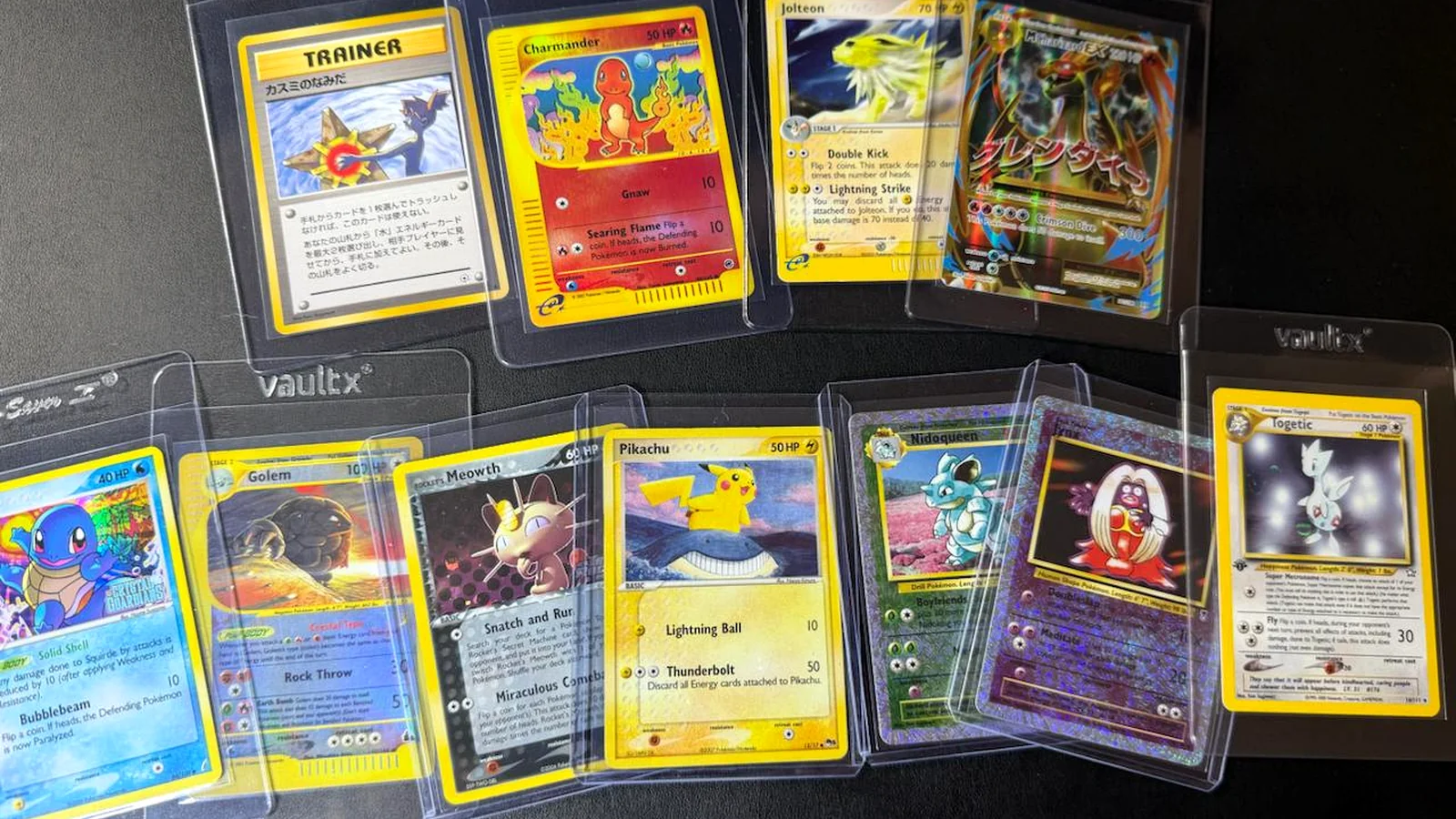 Pokemon cards protected in top loaders and card holders